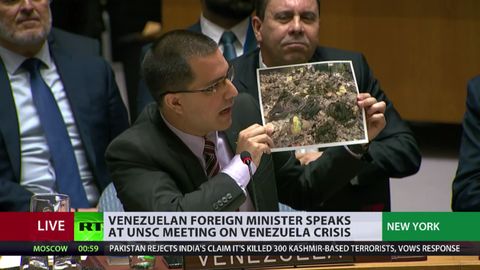 Venezuela’s Foreign Minister Jorge Arreaza shows images at the UNSC